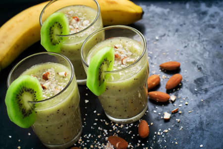 Healthy smoothie with fruit, almond and oat bran.の写真素材