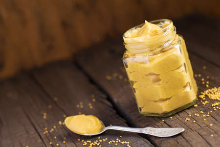 Jar of homemade mustard sauce, selective focus.の写真素材