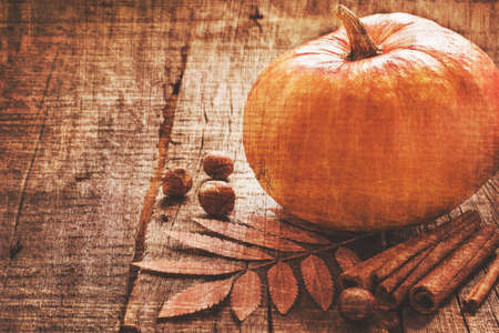 Autumn background with pumpkin in a vintage toning with copy spaceの写真素材