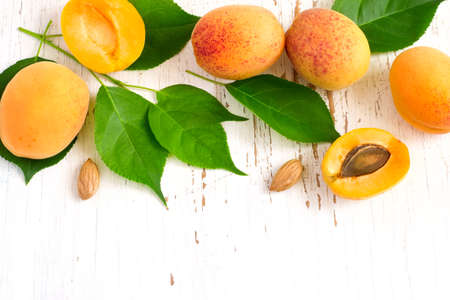 White background with ripe apricots. Top view with copy space.の写真素材