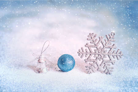 Magic blue Christmas and New Year background with with snowflakes, balls and bellの写真素材