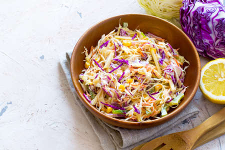 Salad coleslaw in a wooden bowl, Top view with copy space.の写真素材