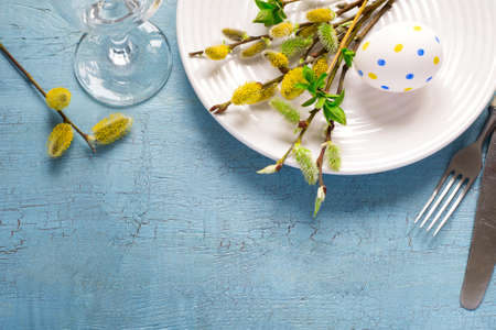 Spring Easter Table setting on a wooden table. Top view