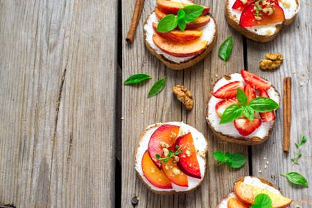 Fruit Bruschetta with cottage cheese and spices.の写真素材