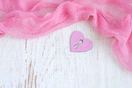Valentine day background with hearts and flowing fabric. Top view with copy spaceの写真素材
