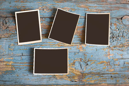 Set of old photos on a blue background, top view.の写真素材