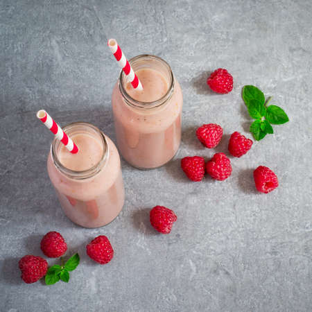 Milk shake with raspberries and berries. Top view 