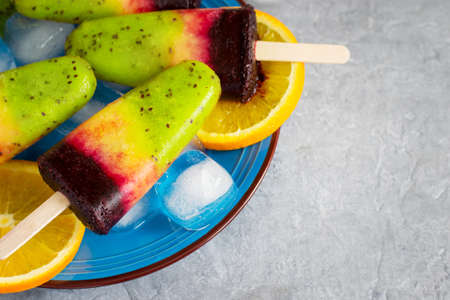 Colorful ice cream on a stick made from natural fruit, selective focusの写真素材