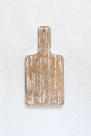 empty wooden cutting board on a white background. Top view with copy spaceの写真素材