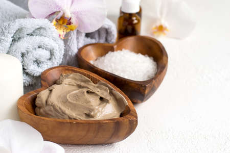 Spa setting with cosmetic clay mask for body and face, Towel and  Essential oilの写真素材