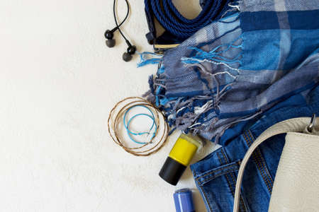 Flat lay Set of casual female clothes And accessories in blue tones. Top view with copy space