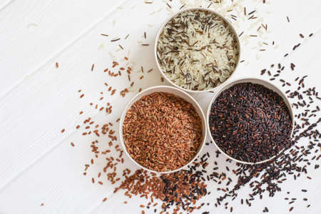 Set of variety of gourmet rice in bowls. Top view with copy spaceの写真素材