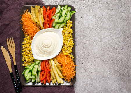 Homemade mayonnaise sauce And set of colorful vegetables. Russian salad goat in the garden. Top view with copy space.の写真素材