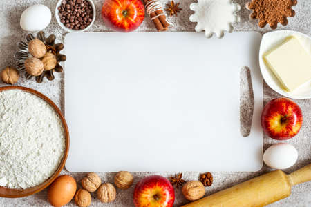 empty cutting board and Ingredients for baking with apples and spices.の写真素材