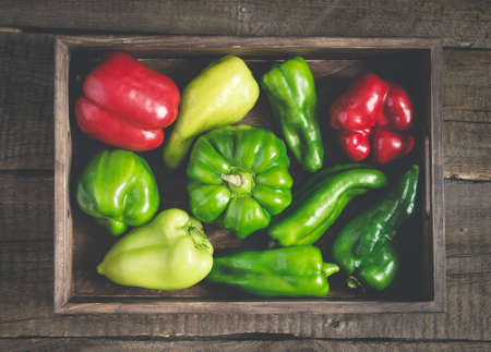 Set of red and green bell peppers of various shapes. Full vegetable tray.の写真素材