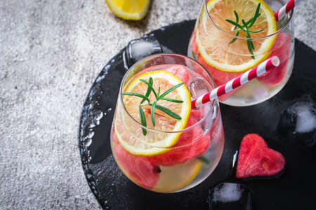 Watermelon lemon cocktail with pieces of watermelon in shape of heart. Valentine's Day Concept.の写真素材