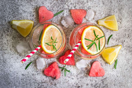 Watermelon lemon lemonade with pieces of watermelon in shape of heart. Refreshing summer drink concept.の写真素材