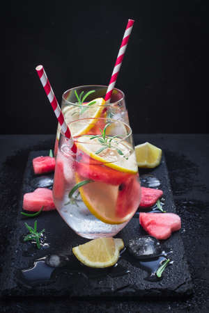 Watermelon lemon Refreshing summer drink with pieces of watermelon in shape of heartの写真素材