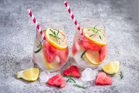 Watermelon lemon lemonade with pieces of watermelon in shape of heart. Refreshing summer drink conceptの写真素材