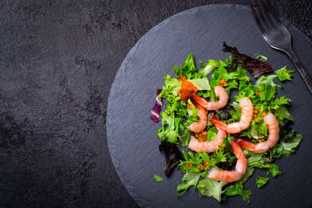 Christmas Healthy Diet Food. Christmas tree made from lettuce leaves and shrimp.の写真素材