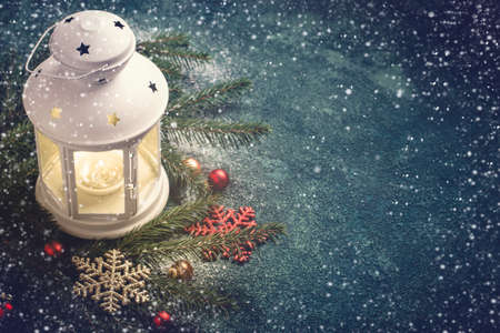 Christmas background. Composition of a lantern and fir branches.
