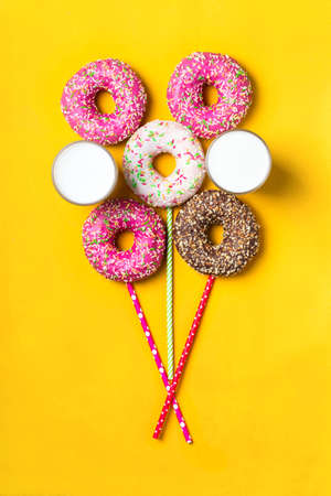 Balloon of donuts and milk on yellow background.の写真素材