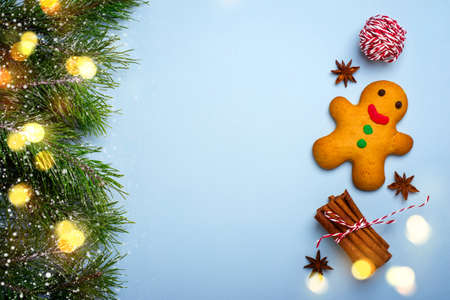Christmas blue background with gingerbread man and spices.の写真素材