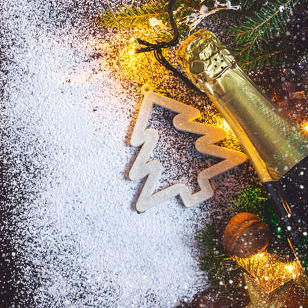 Christmas card background with Christmas fir and champagne.