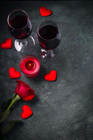 Valentines day greeting card concept. Wine glasses, rose and candle.の写真素材