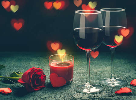 Valentines day greeting card concept. Wine glasses, rose and candle の写真素材