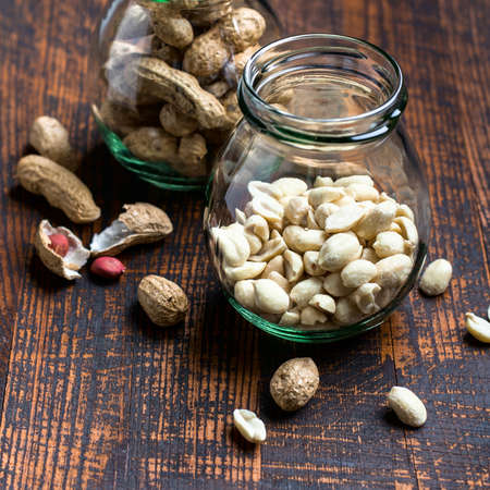 Peanut snack in jar on dark background.の写真素材