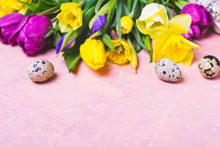 Border of spring multicolored flowers and Easter Eggs.の写真素材
