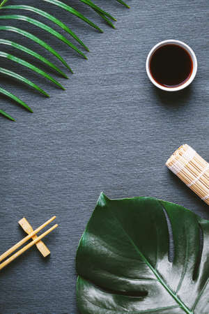Asian food background. Chopsticks and soy sauce.の写真素材