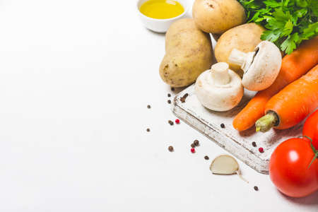 Mushrooms, potatoes and carrots on a white background. Set of fresh vegetables.の写真素材