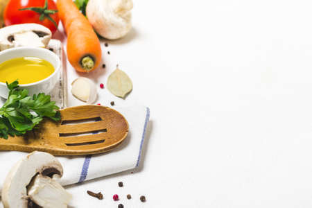 Food cooking background. Fresh vegetables, spices and mushrooms on white background.の写真素材