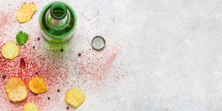 Food background. Potato chips, beer and spices flat lay.の写真素材