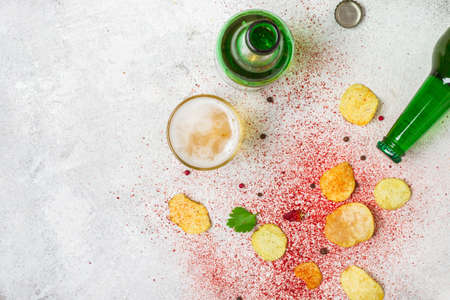 Food background. Potato chips, beer and spices flat lay.の写真素材