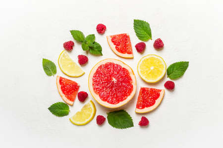 Citrus, raspberry and mint on white. Health detox concept.の写真素材