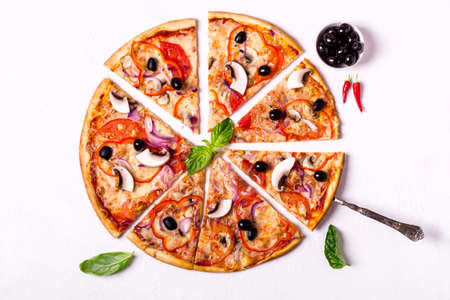 Vegetarian pizza pieces with mushrooms and olives on white background.