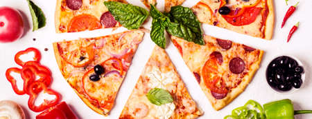 selection of Assorted pieces pizza on white background and ingredients. Pepperoni, Vegetarian and...