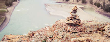 Stone tower on rock. The confluence of Chuya and Katun rivers. Altai Russia.の写真素材