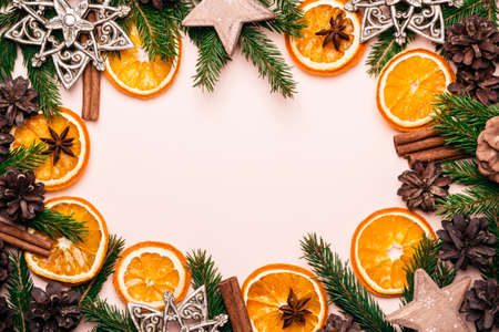 Christmas natural frame of Dry Oranges Slices, fir cones and branches.の写真素材
