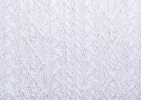 Knitted white texture with pattern of various braids.の写真素材