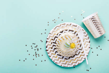 Party Turquoise  with paper gold dishes and confetti.の写真素材