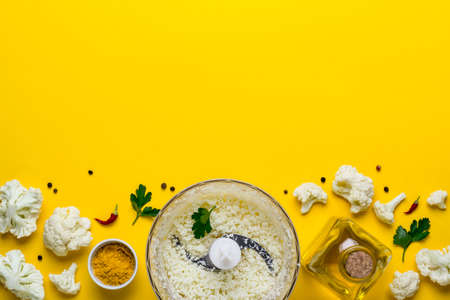 Blender bowl with freshly prepared cauliflower rice and spices.の写真素材