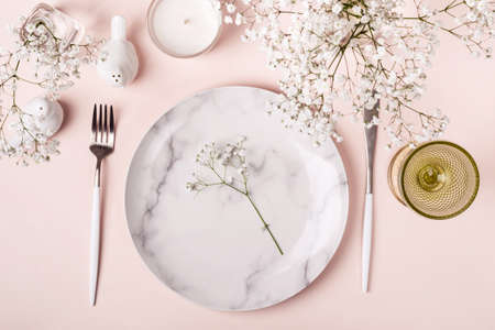 Romantic table setting in pink colors. White flowers decorの写真素材