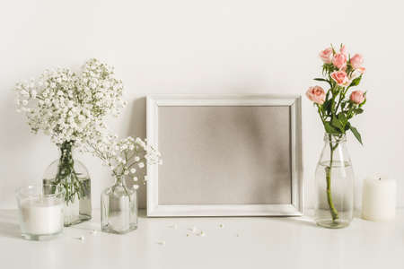 Romantic elegant flowers arrangement on table wallの写真素材