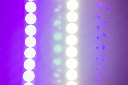 Abstract violet background of blurred led strip lights and reflections. Retro colors.