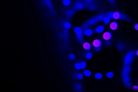 Blue neon blurry spiral led lights on black. Abstract background for your design.の写真素材