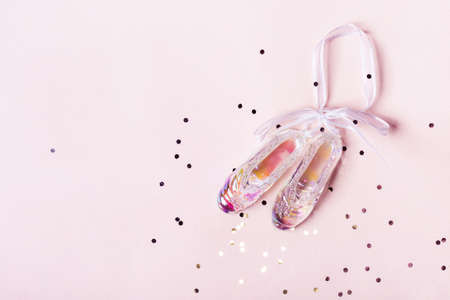 Christmas toy pointe shoes made of transparent holographic glass. Christmas concept.